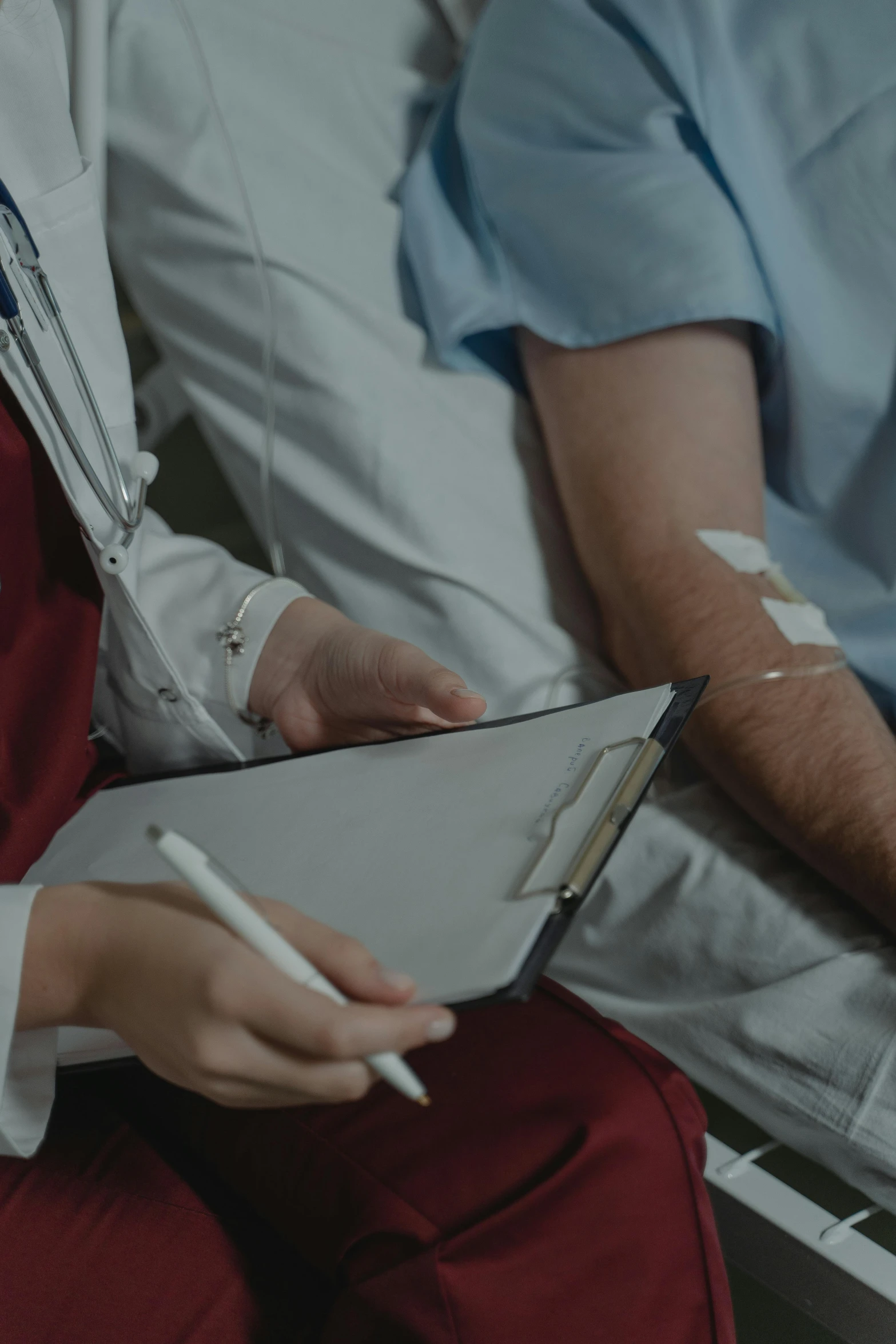 a close up of a person in a hospital bed, holding a clipboard, dialogue, fighting for his life, background image