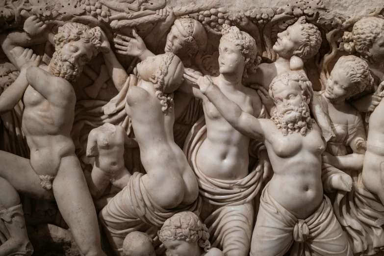 a group of statues sitting next to each other, a marble sculpture, by Luca della Robbia, trending on pexels, sirens, carved ivory, lesbians, in an ancient tomb