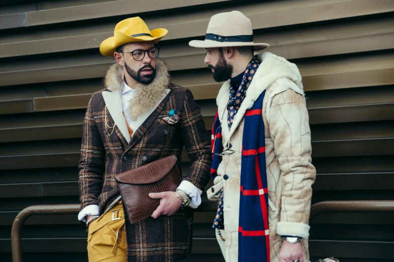 a couple of men standing next to each other, a photo, inspired by Francesco Furini, shutterstock, fashion week, square, lumberjack, elaborate clothing