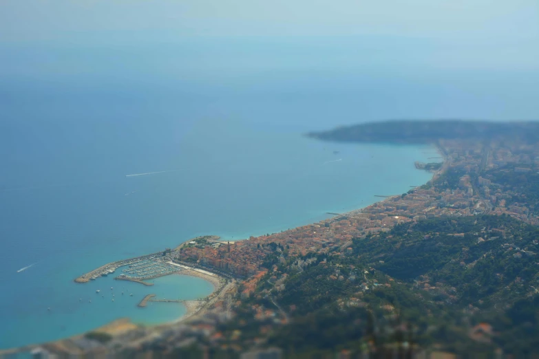 an aerial view of a large body of water, a tilt shift photo, by Romain brook, italian mediterranean city, slide show, square, no crop