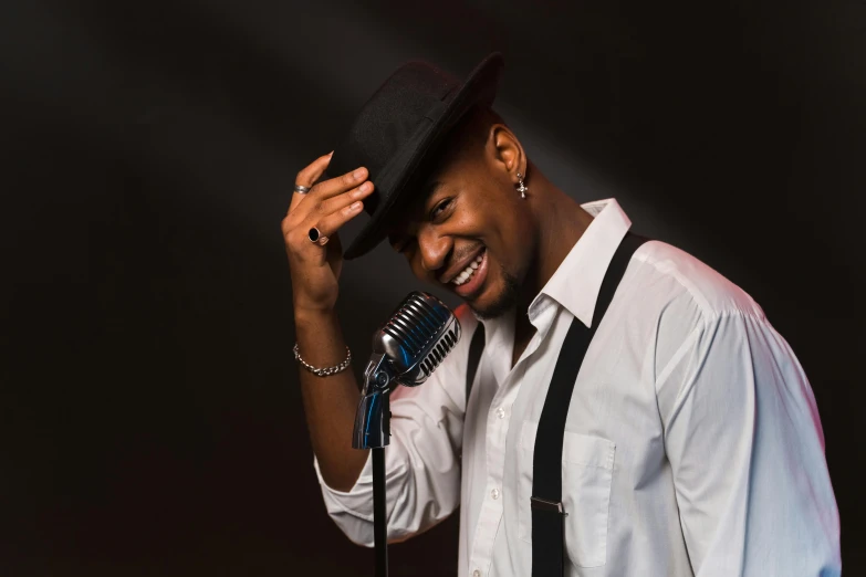 a man wearing a hat and holding a microphone, inspired by Michael Ray Charles, pexels contest winner, harlem renaissance, smiling seductively, 15081959 21121991 01012000 4k, avatar image, doing an elegant pose