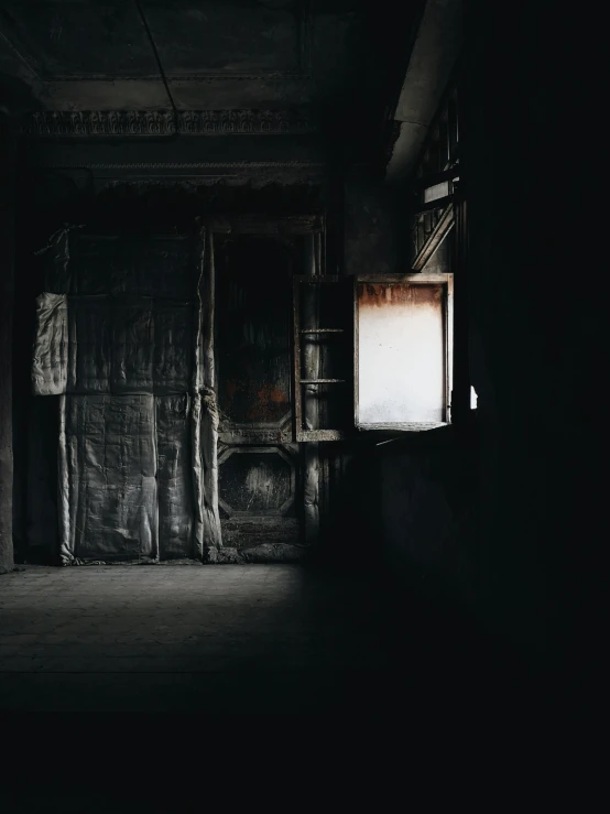 a dark room with a window in it, dusty light, lantern light besides, grey warehouse background, unsplash photo contest winner