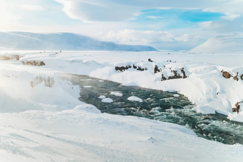 a river running through a snow covered valley, pexels contest winner, hurufiyya, cubes of ice around, björk, conde nast traveler photo, lagoon