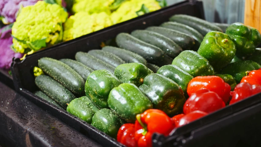 a display of cucumbers, peppers, and broccoli, a picture, unsplash, portrait image, performing, mid shot photo