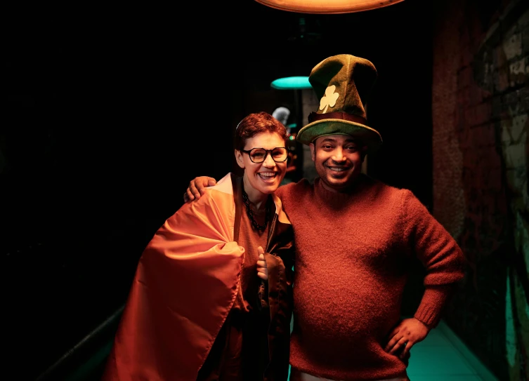 a couple of men standing next to each other, pexels, renaissance, wizard hat cinematic lighting, standing in a cantina, with a green cloak, betty la fea
