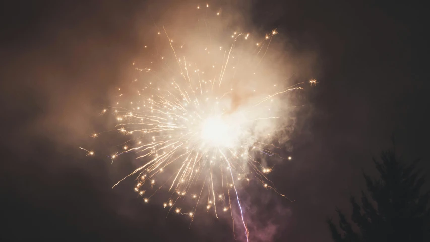 a fireworks is lit up in the night sky, unsplash, retro vibe, instagram photo, grey, medium closeup