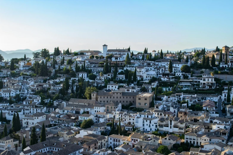 a view of a town from the top of a hill, pexels contest winner, renaissance, moorish architecture, white, spanish, slightly pixelated
