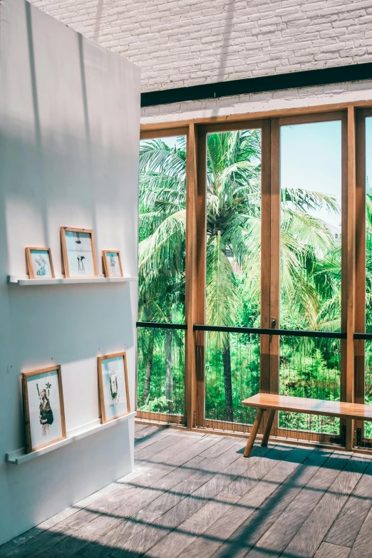 a wooden bench sitting on top of a wooden floor, a picture, visual art, palm trees outside the windows, bali, gallery display photograph, instagram photo