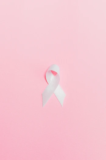a pink ribbon on a pink background, by Silvia Pelissero, an all white human, 2 5 6 x 2 5 6, #trending, white ribbon