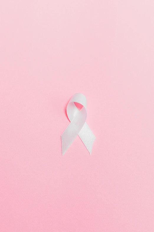 a pink ribbon on a pink background, by Silvia Pelissero, an all white human, 2 5 6 x 2 5 6, #trending, white ribbon