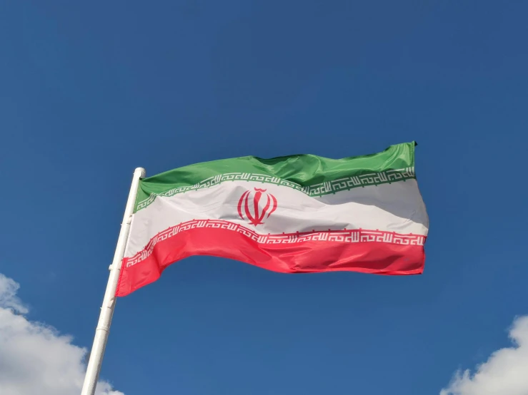 the flag of iran flies high in the sky, an album cover, pexels, clear blue skies, ignant, graphics card, leaked image