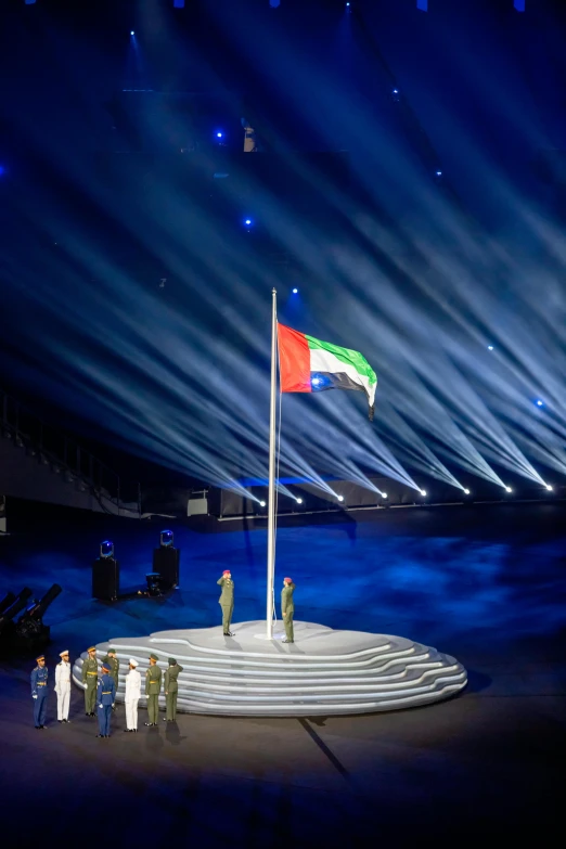 a group of people standing on top of a stage, italian flag, arab ameera al taweel, during the night, thumbnail