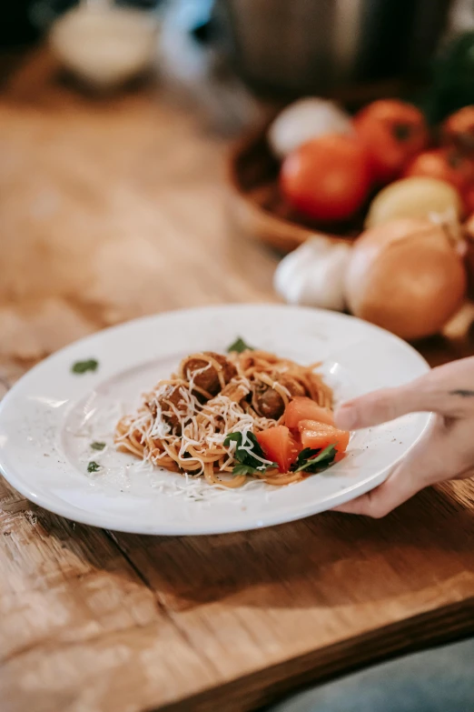 a close up of a plate of food on a table, pexels contest winner, eats pasta all the time, hands on counter, healthy, gif