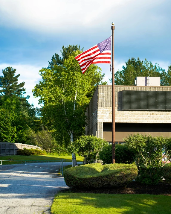 an american flag flying in front of a building, lynn skordal, well built, profile image, museum photo