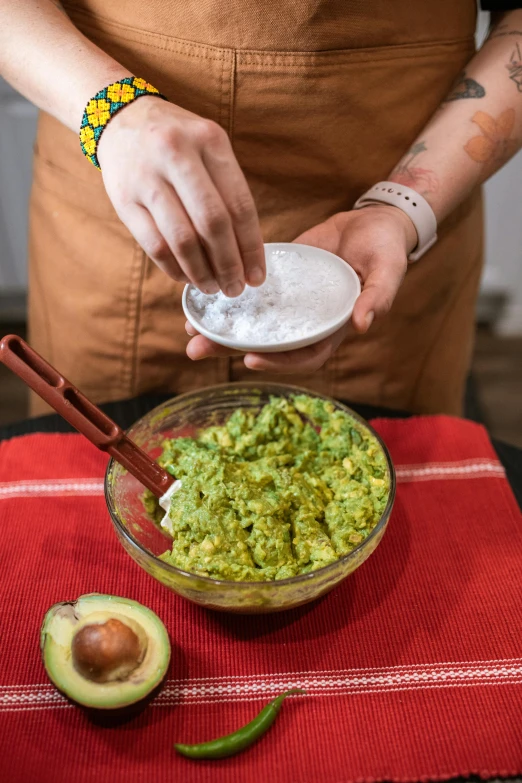 a woman holding a bowl of guacamole next to an avocado, process art, partially cupping her hands, rice, photo taken in 2 0 2 0, slide show