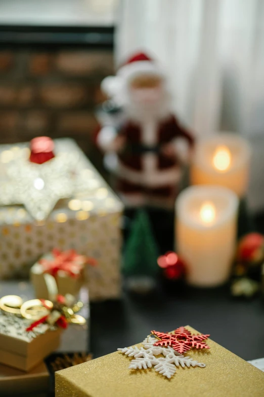 a group of presents sitting on top of a table, by Julia Pishtar, pexels contest winner, shining gold and black and red, candle lights, promo image, up close shot