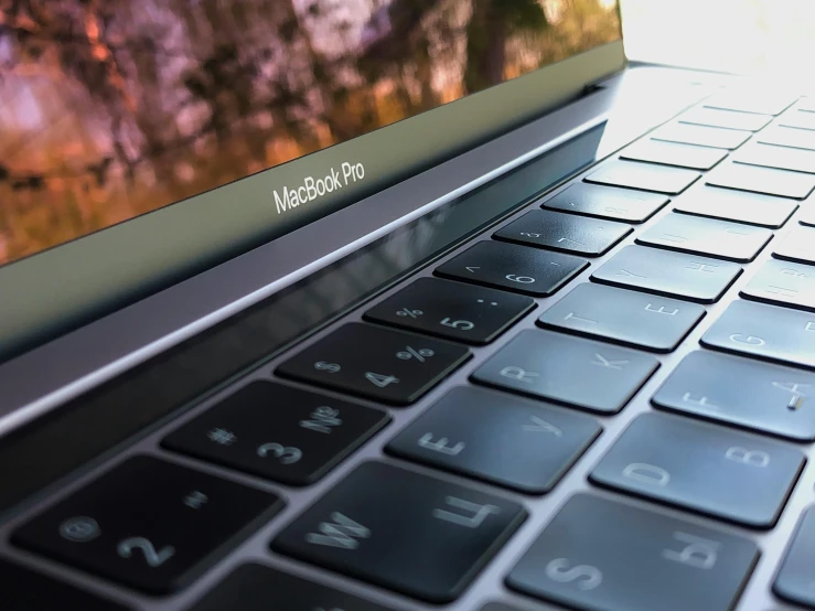 a laptop computer sitting on top of a table, by Carey Morris, pexels, close up. macro. hyper realistic, apple, rectangle, 15081959 21121991 01012000 4k