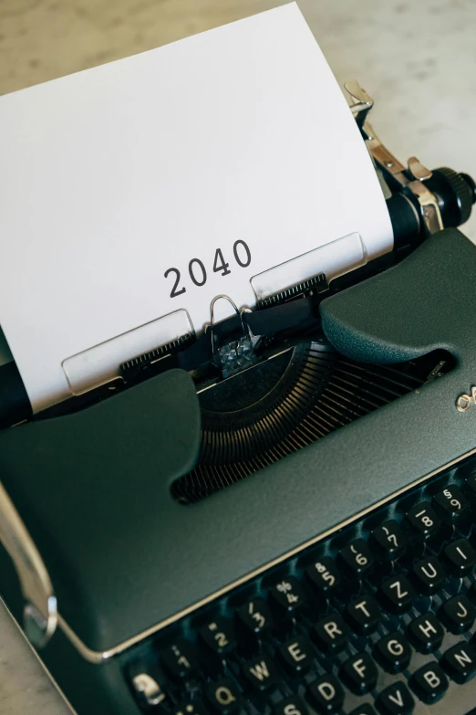 a typewriter with a sheet of paper on top of it, trending on unsplash, hypermodernism, year 2 0 4 0, phone photo, futuristic year 4 0 0 0, thumbnail