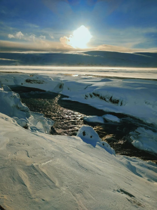 a man riding skis down a snow covered slope, a hyperrealistic painting, hyperrealism, with a river running through it, solar eclipse in iceland, award - winning photo ”