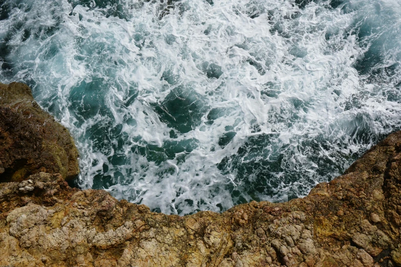 a view of the ocean from the top of a cliff, an album cover, pexels contest winner, extremely detailed water texture, whirlpool, cyprus, teal aesthetic