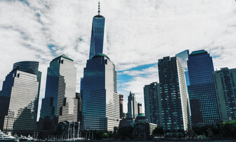 a group of tall buildings next to a body of water, pexels contest winner, new jersey, monumental structures, high resolution, instagram post