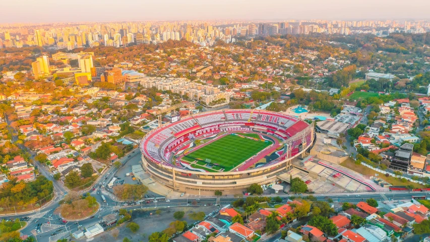 an aerial view of a soccer stadium in mexico, pexels contest winner, art nouveau, são paulo, beautiful morning, 🐋 as 🐘 as 🤖 as 👽 as 🐳, helicopter footage over city