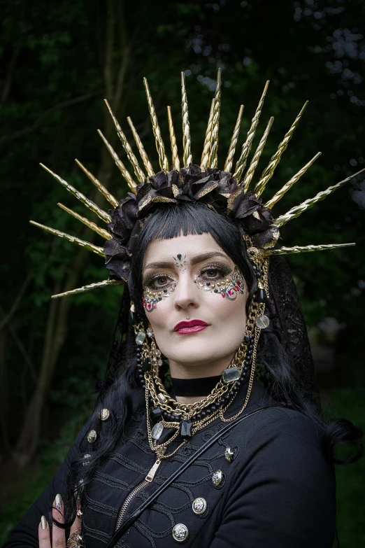 a close up of a person wearing a costume, inspired by Hedi Xandt, reddit, international gothic, in a spiky tribal style, deity leesha hannigan, circlet, morgana