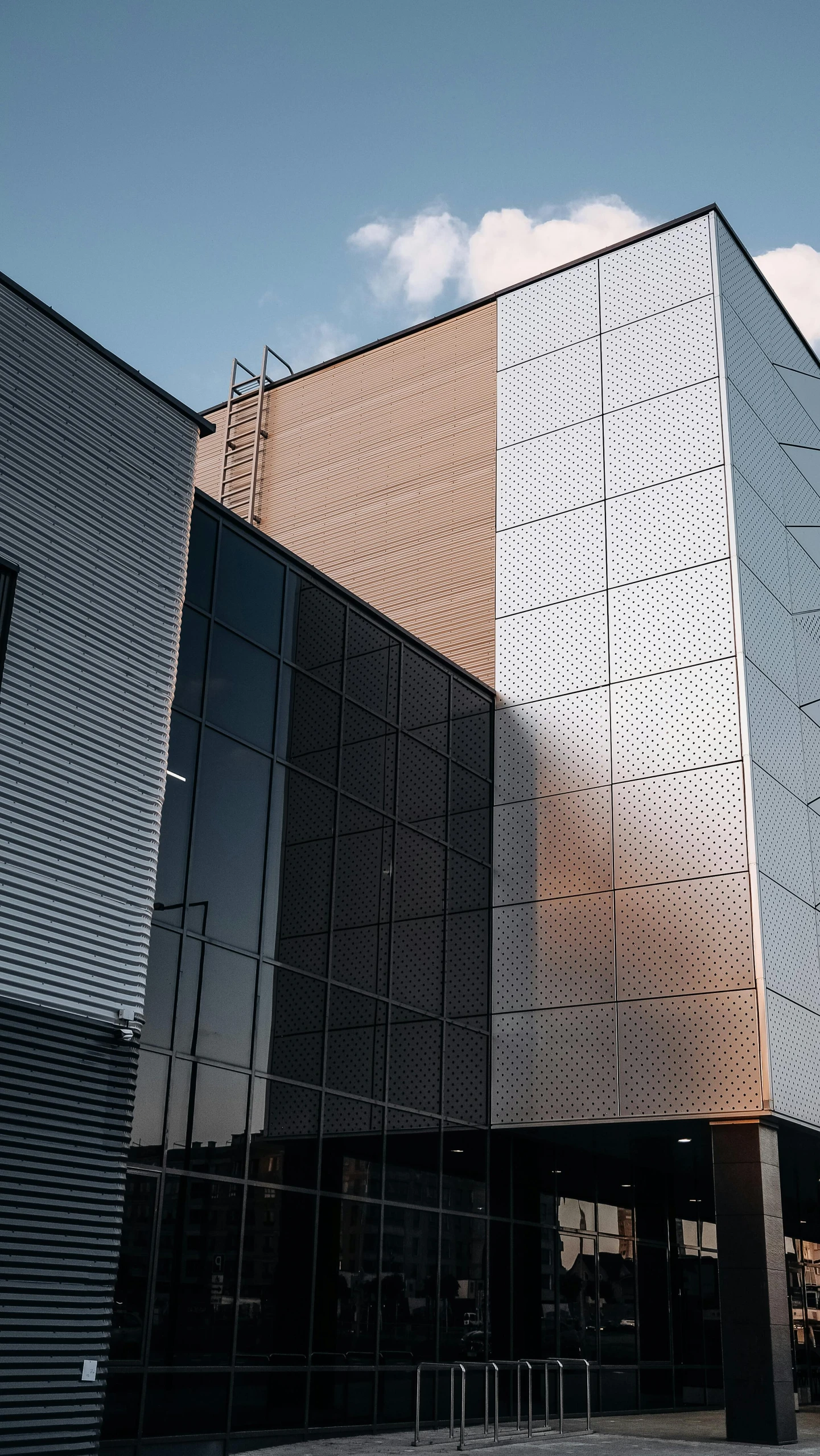 a close up of a building with a sky background, a 3D render, unsplash, metal panels, tall factory, datacentre, cinematic shot ar 9:16 -n 6 -g