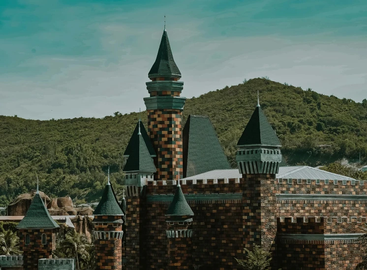 a castle sitting on top of a lush green hillside, pexels contest winner, art nouveau, amusement park buildings, ultra high quality model, brown, magical school