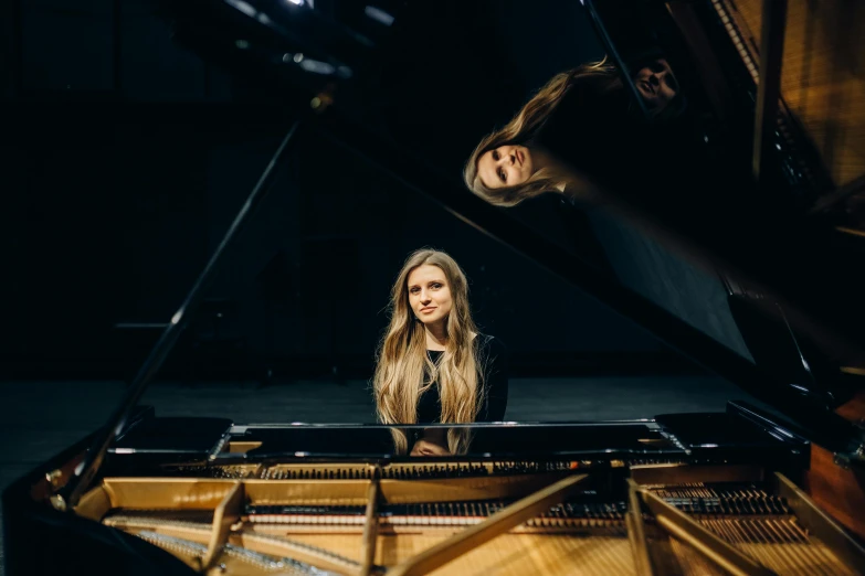 two women sitting at a piano in a dark room, a portrait, by Anna Haifisch, unsplash, portrait of sanna marin, plain background, avatar image, erin moriarty