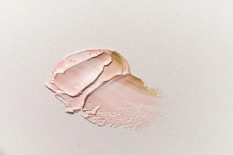 a close up of a pink substance on a white surface, inspired by Anna Füssli, trending on pexels, photorealism, beige, skincare, painted, light tan