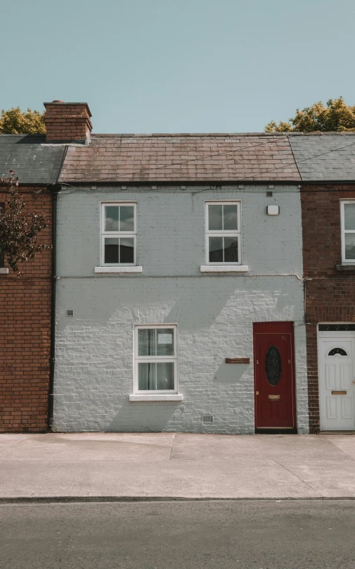 a couple of houses sitting on the side of a road, inspired by Thomas Struth, pexels contest winner, photorealism, brick building, front elevation, tiny house, mint