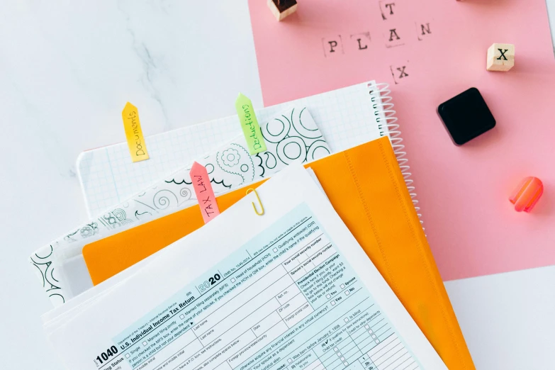 a pile of papers sitting on top of a table, a screenshot, by Julia Pishtar, trending on pexels, pink and orange, planner stickers, forms, thumbnail