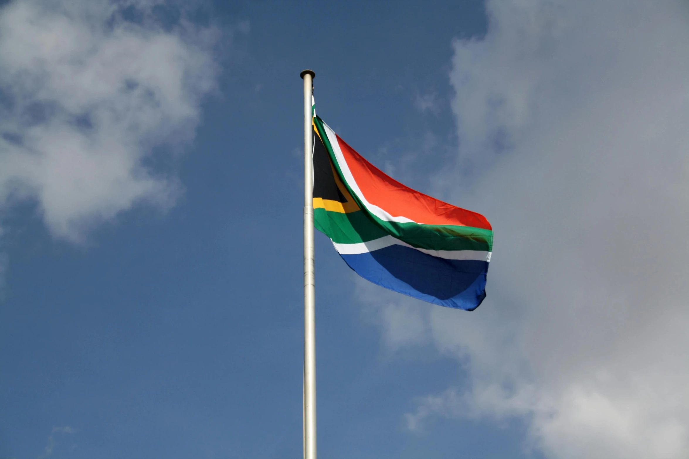 the flag of south africa flies high in the sky, an album cover, unsplash, hurufiyya, square, 15081959 21121991 01012000 4k, township, netherlands