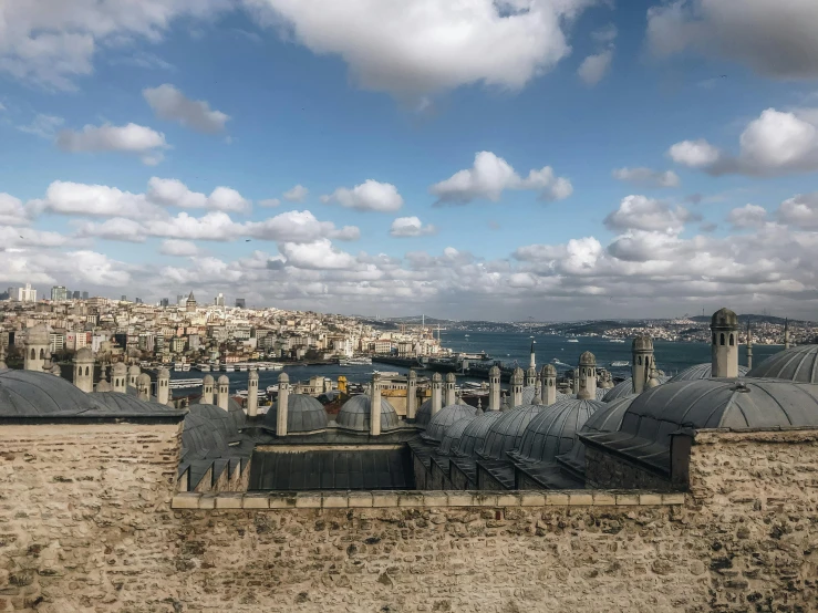 a view of a city from the top of a building, a detailed matte painting, pexels contest winner, hurufiyya, istanbul, gray, brown, city walls