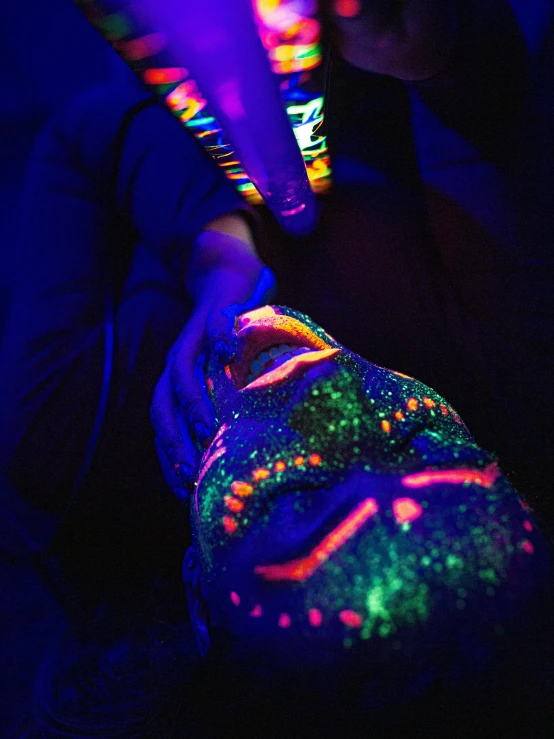 a person holding a glowing object in their hand, by Julia Pishtar, holography, feet art pov, day - glow facepaint, neon aztec, relaxing