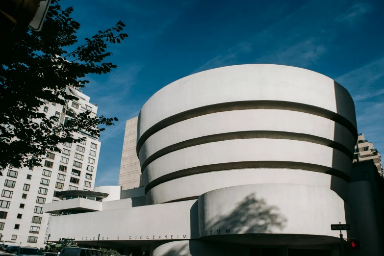 the frank frank frank frank frank frank frank frank frank frank frank frank frank frank frank frank frank, unsplash, modernism, frank lloyd wright, round buildings in background, metmuseum, wim wenders