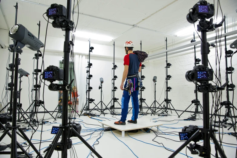 a man standing in a room filled with lots of lights, photogrammetry, sensor array, image, test