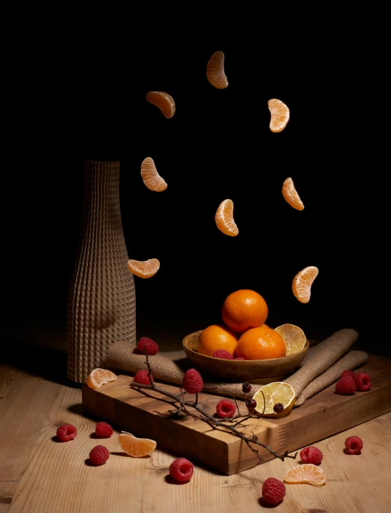 a bowl of fruit sitting on top of a wooden table, a still life, inspired by François Bocion, pexels contest winner, orange and red lighting, wide angle dynamic action shot, raspberry, scattered props