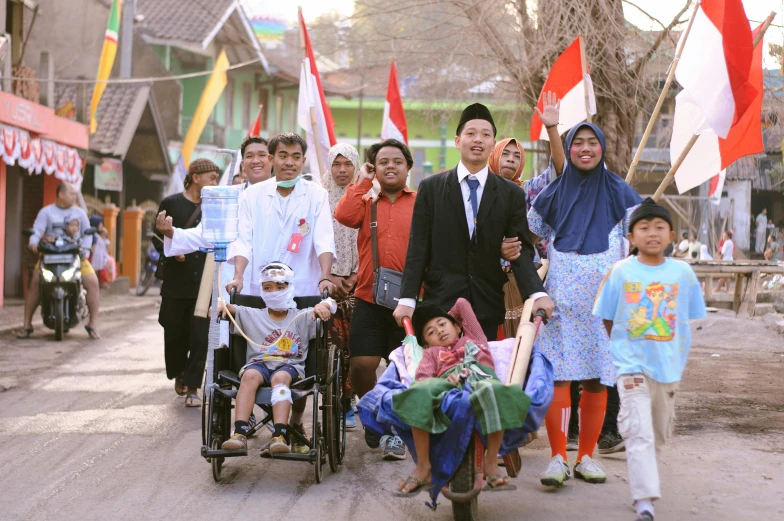 a group of people that are standing in the street, sumatraism, prostheses, patriotism, competition winning, hana alisa omer