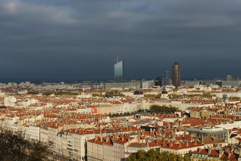 a view of a city from the top of a hill, pexels contest winner, art nouveau, french, square, afternoon light, 2000s photo