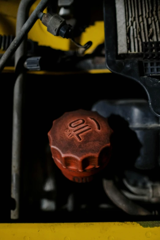 a close up of the engine of a train, by David Simpson, unsplash, auto-destructive art, made of rubber, faded worn, brown, garage