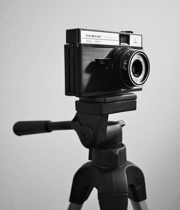 a black and white photo of a camera on a tripod, inspired by Diane Arbus, unsplash, medium format, photography )