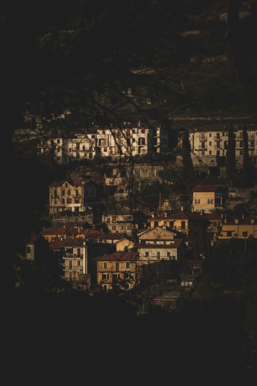 a black and white photo of a city at night, a picture, by Alessandro Allori, renaissance, color image, tiny village, golden hour, flat - color