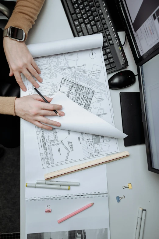 a person sitting at a desk working on a project, a detailed drawing, structural, promo image, white map library, technical detail