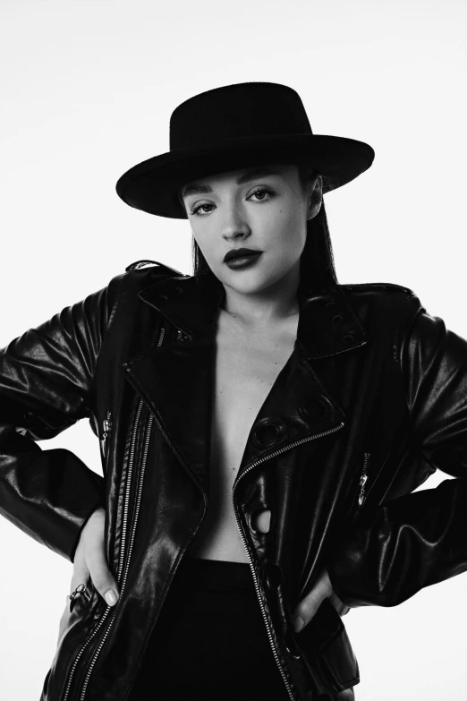 a black and white photo of a woman wearing a hat, by Gavin Hamilton, dressed in short leather jacket, bella poarch, promo image, a young asian woman