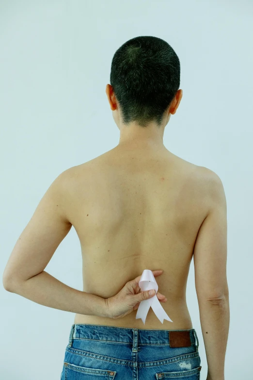 a man with a white ribbon on his back, gutai group, medical photography, rinko kawaichi, medium - shot, 奈良美智