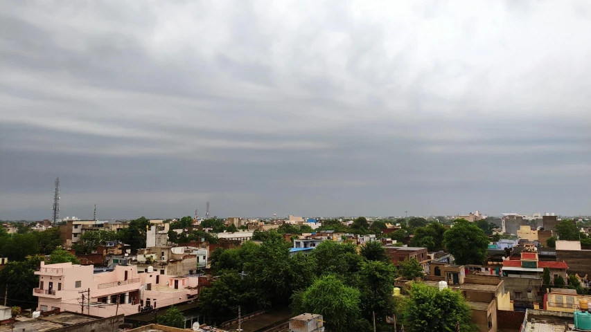 a view of a city from the top of a building, by Kailash Chandra Meher, samikshavad, cloud day, midday photograph, brown, 5 feet away