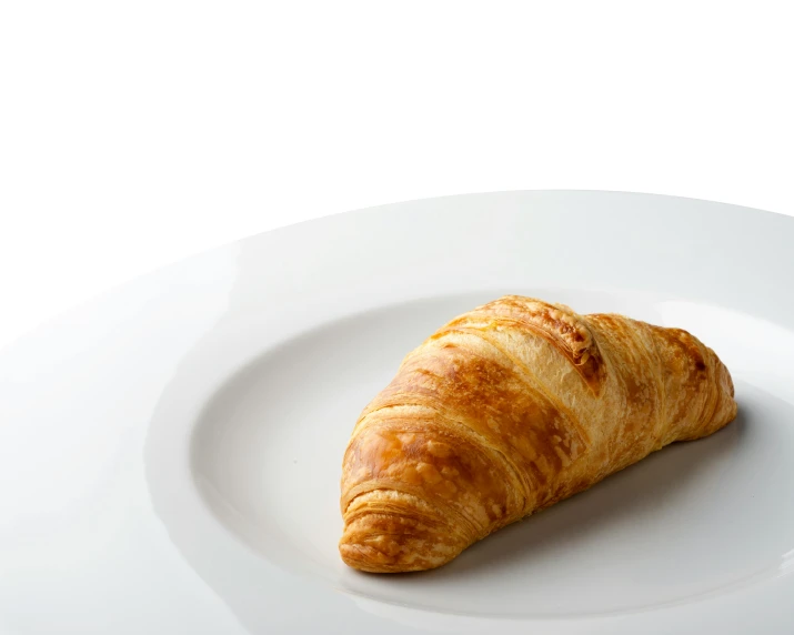 a croissant on a white plate on a table, inspired by Charles Le Roux, unsplash, photorealism, on clear background, breakfast buffet, detailed product image, flattened