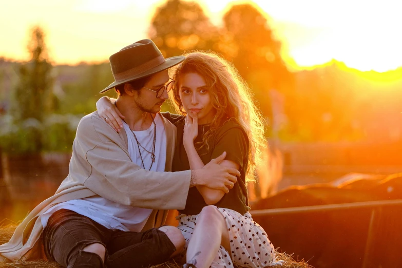 a man and a woman sitting on top of a pile of hay, by Julia Pishtar, pexels contest winner, renaissance, gorgeous romantic sunset, soft shade, a handsome, music video